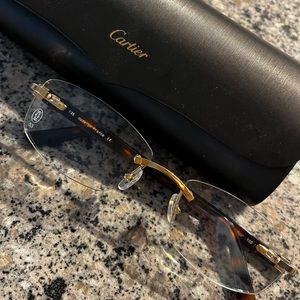 RIMLESS CARTIER GLASSES